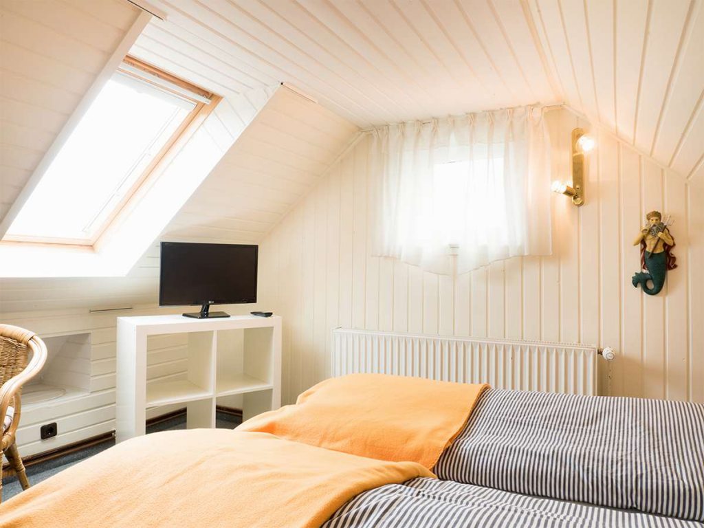 EIn Blick in das Schlafzimmer der Ferienwohnung Nr. 5 auf Norderney